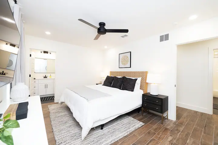 Sandy Shores Oasis bedroom with television and attached bathroom