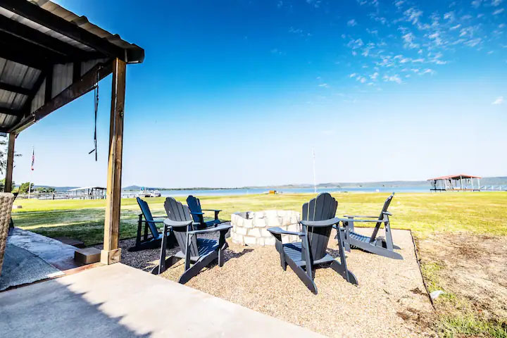 Sandy Shores Oasis outdoor fire pit by the lake