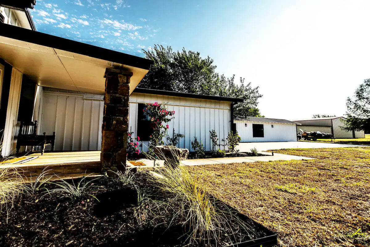 Sandy Shores Oasis front porch view with flowers and landscaping