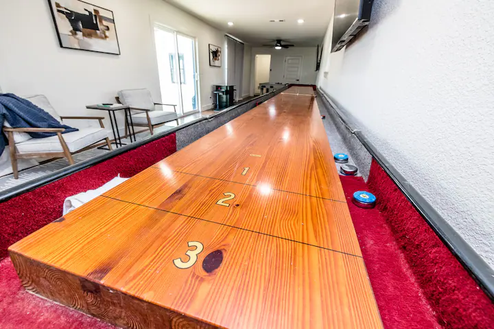 Sandy Shores Oasis shuffleboard in a game room