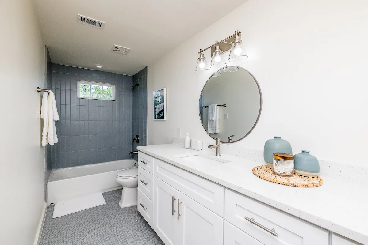 Sandy Shores Sanctuary bathroom with extended sink space and tub shower