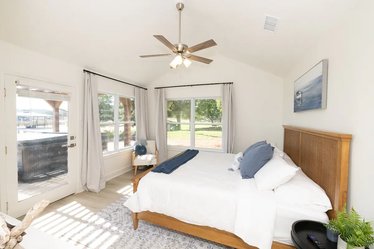 Sandy Shores Sanctuary bedroom with door to hot tub