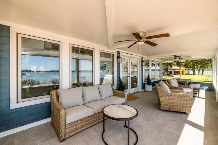 Sandy Shores Sanctuary covered patio with couches and tables