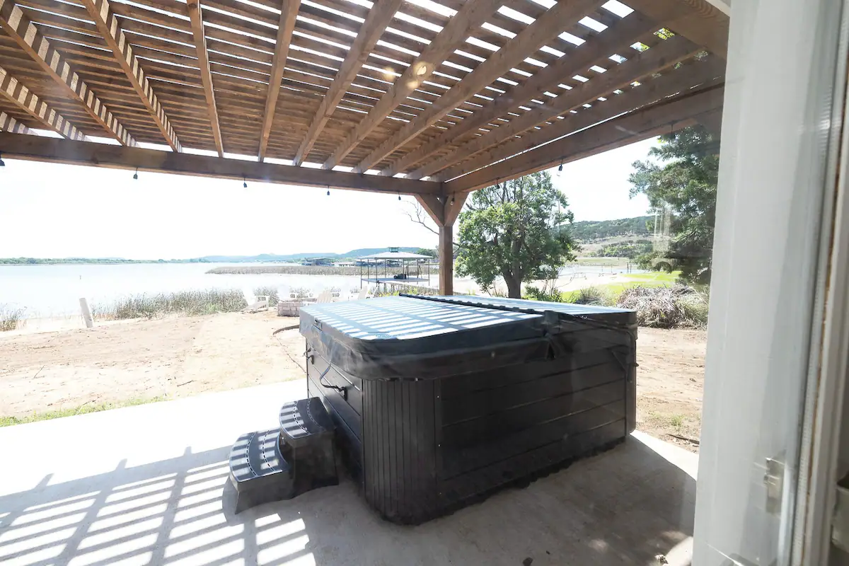 Sandy Shores Sanctuary covered hot tub on patio