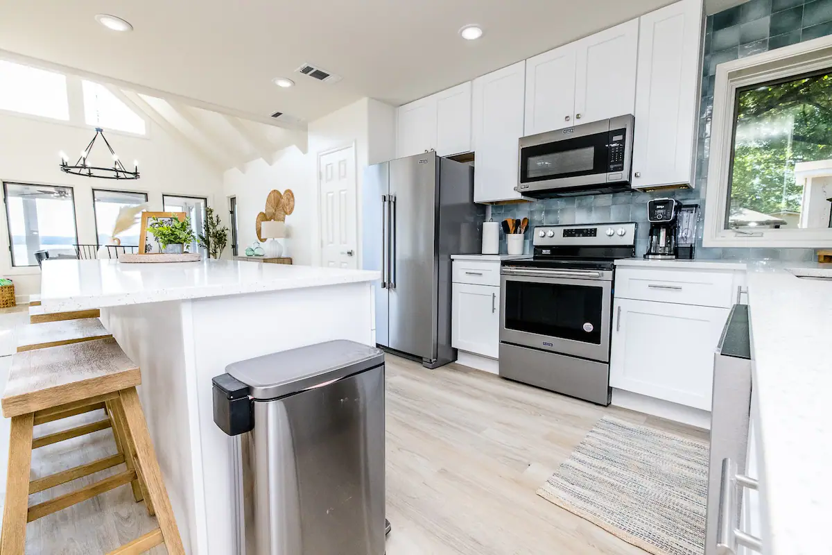 Sandy Shores Sanctuary large kitchen with island and bar stools