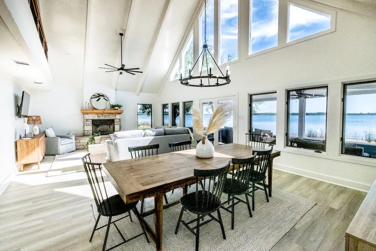 Sandy Shores Sanctuary dining room overlooking living room with lake view