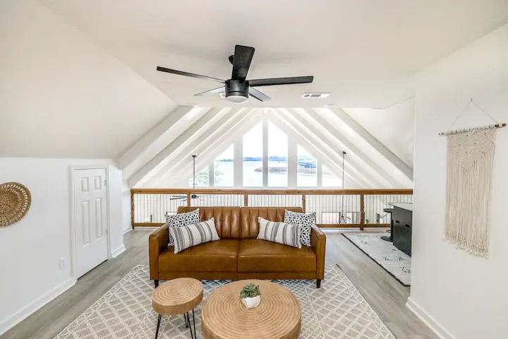 Sandy Shores Sanctuary upstairs loft with couch and tables